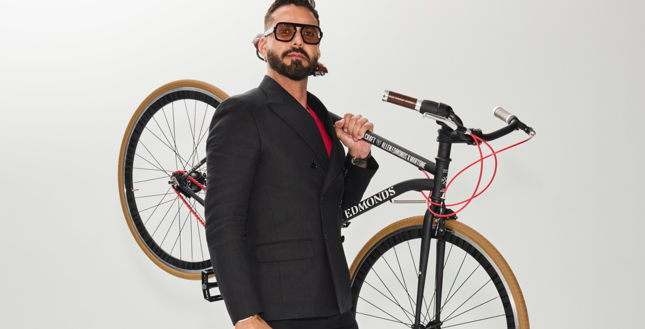 lorenzo martone holding a bicycle