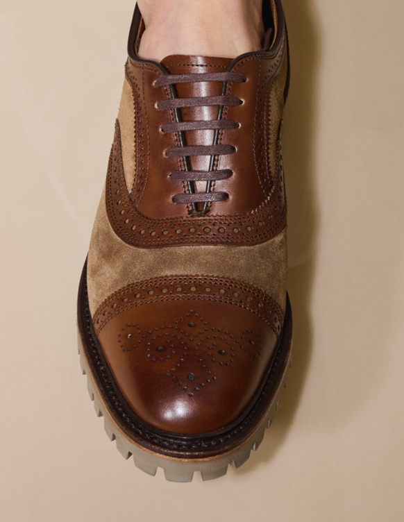 brown leather and tan suede wingtip with lug sole