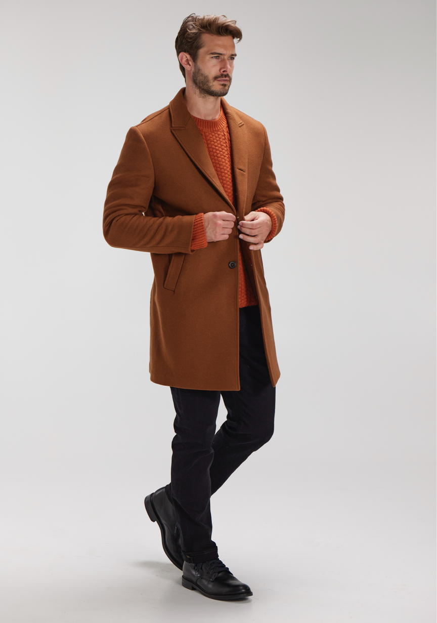man wearing billy reid car coat