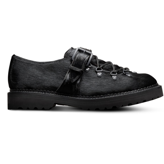 A side view of the Allen Edmonds Adirondack Low Hiking shoe in black calf hair, with the toe facing right.