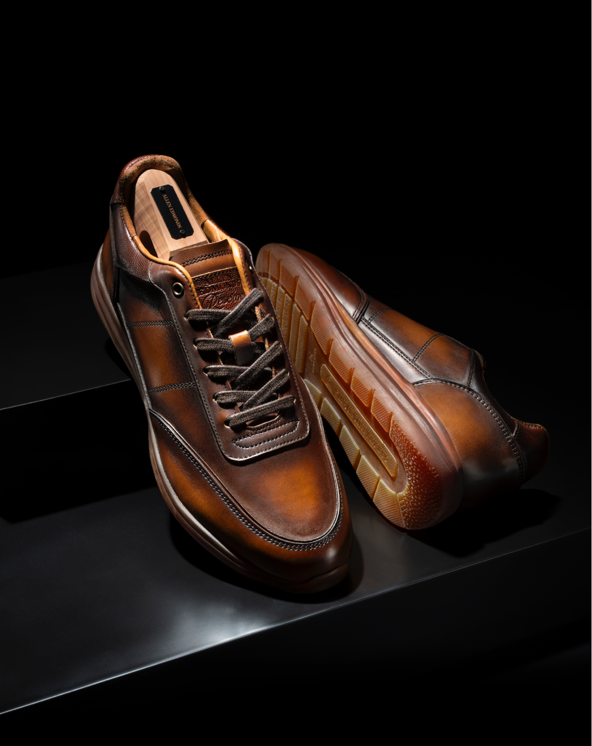 Angled view of a pair of Allen Edmonds Brentwood Reserve Lace Up Sneakers in brown leather.  