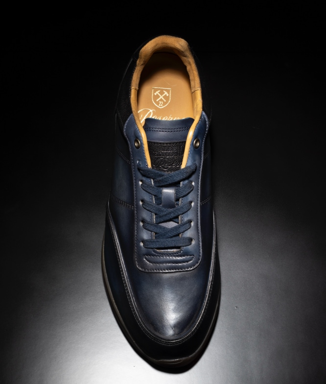 Top view of the Allen Edmonds Brentwood Reserve Lace Up Sneaker in navy leather.  