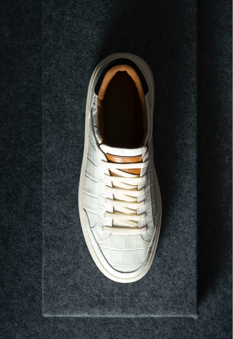 Top view of the Allen Edmonds Oliver Slip on Sneaker in white croco leather. 