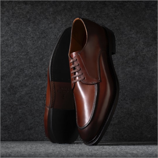 A pair of brown leather dress shoes