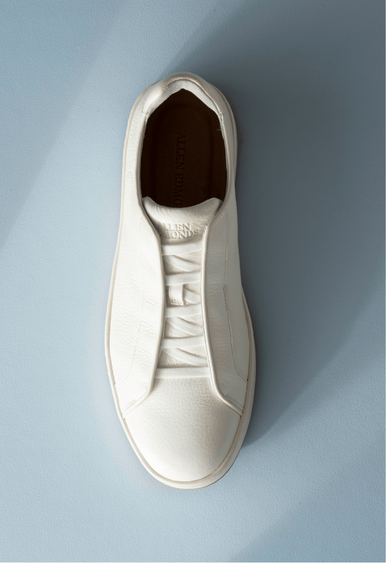 Men’s gray textured leather sneaker with tan rubber sole and brown leather lining