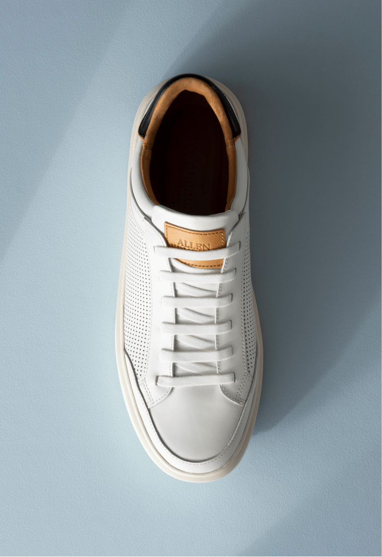 Men’s gray textured leather sneaker with tan rubber sole and brown leather lining