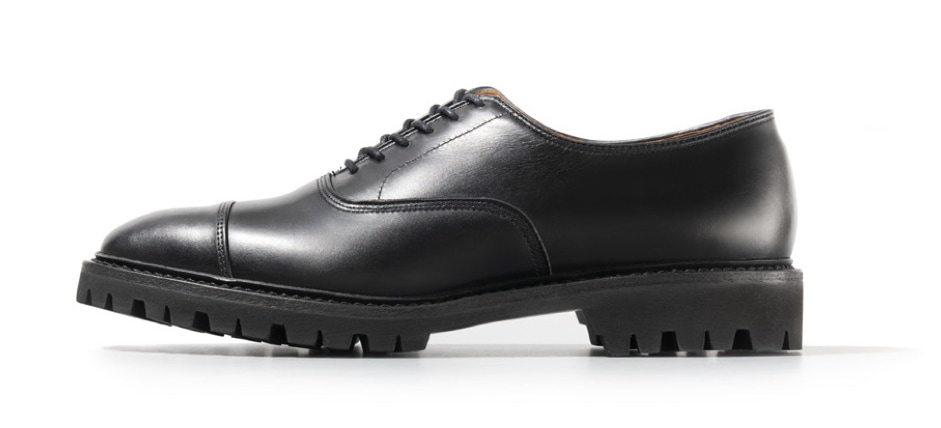 Black cap-toe oxford dress shoe with lug sole