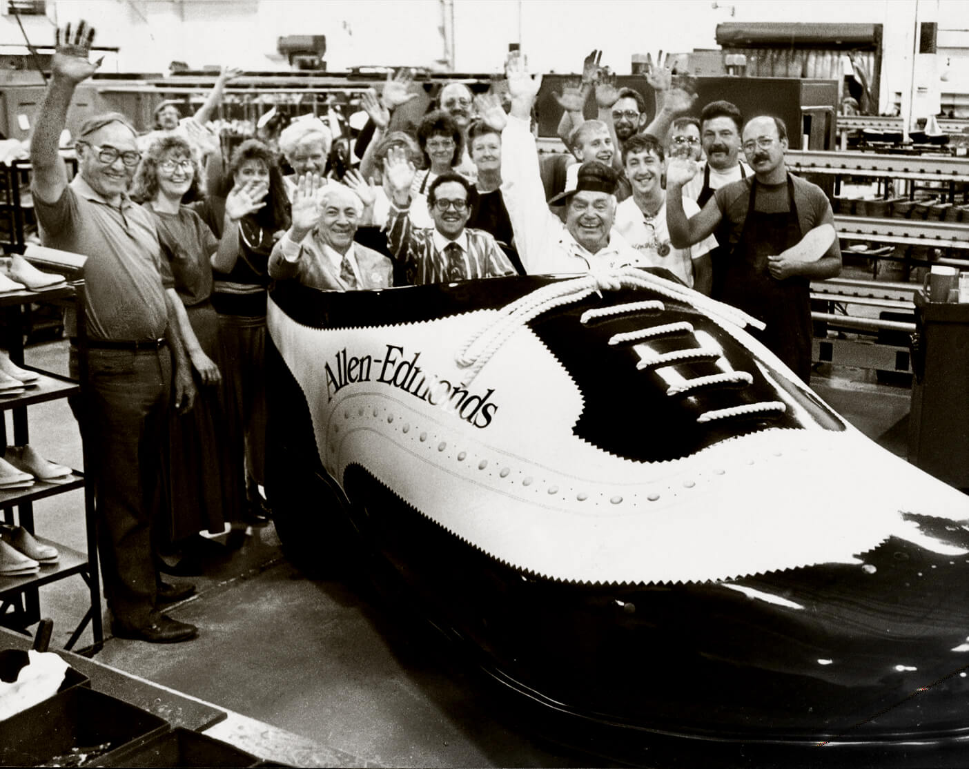 The team in Port Washington with entertainer Ernest Borgnine behind the wheel of the Wingtripper, a giant, drivable shoe that was used for local parades and events in the Milwaukee area.